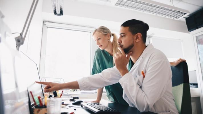 Doctor pointing to screen