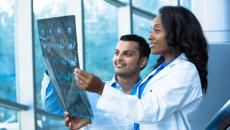 Healthcare workers looking at an X-ray