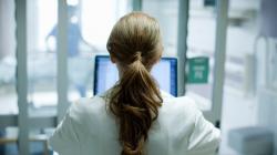 Person using computer in hospital