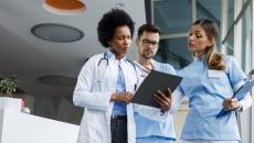 Healthcare workers looking at clipboard