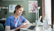 Woman doctor using a computer.